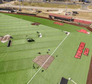 Overhead shot of new UCM field with synthetic grass and logos
