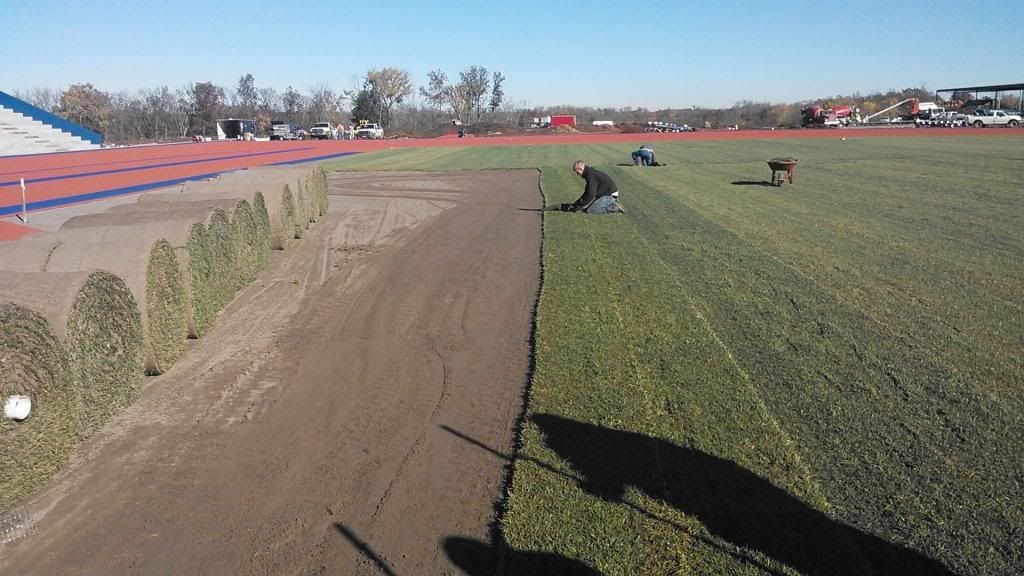 Mid-America Professionals Roll Out Turf on a Natural Grass Field